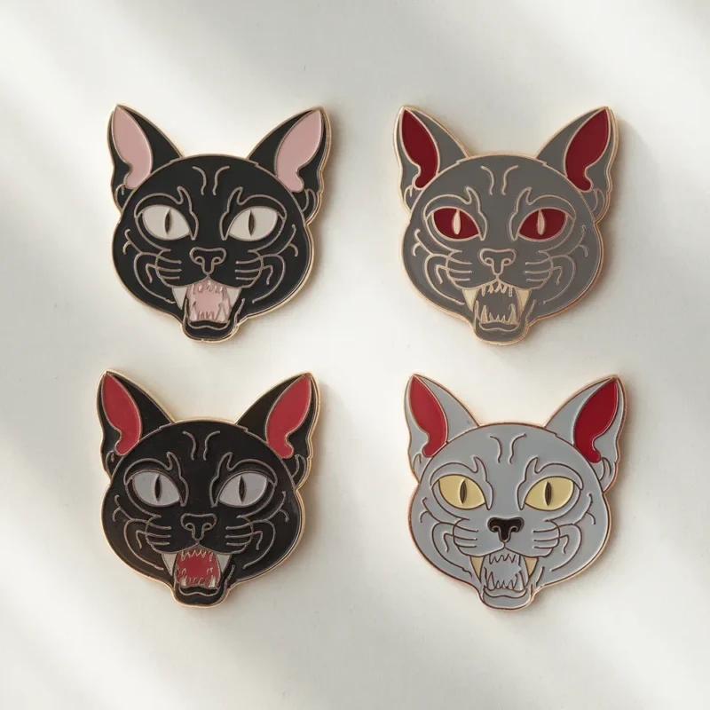 Four colorful horror cat enamel pins featuring unique designs and expressions.