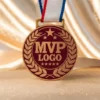 Gold MVP medal with a red ribbon, displayed in a mockup setting, symbolizing achievement and excellence in sports.
