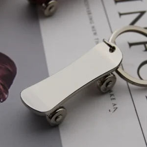 Metal keychain shaped like a skateboard, featuring detailed design and vibrant colors.