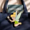 Limited edition Tinker Bell enamel pin featuring her iconic pose with sparkling details and vibrant colors.