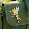 Enamel pin featuring Tinkerbell, a small fairy with delicate wings and a joyful expression.
