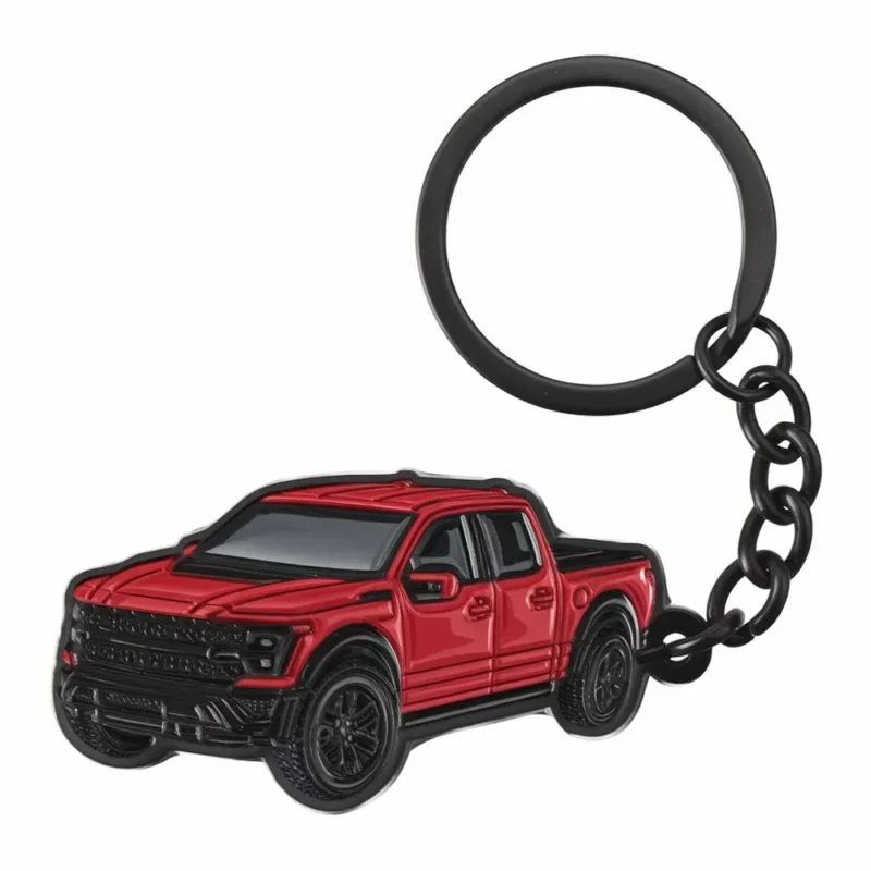 Red enamel truck keychain featuring a black truck design, perfect for truck enthusiasts or as a fun accessory.