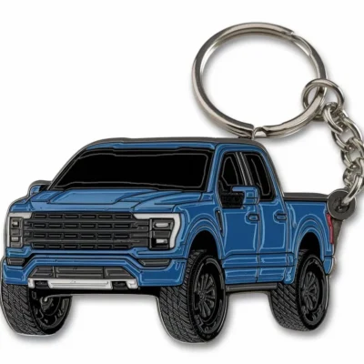 Blue enamel truck keychain featuring a black truck design, perfect for truck enthusiasts or as a stylish accessory.