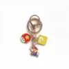 A Nintendo keychain featuring a Mario Bros character, showcasing Mario in his classic red hat and blue overalls.