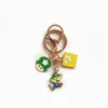 A Nintendo keychain featuring a Mario Bros character, showcasing Mario in his classic red hat and blue overalls.