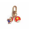 Porte-clés à l'effigie du personnage de Mario Bros, représentant l'emblématique plombier avec son chapeau rouge classique et sa salopette bleue.