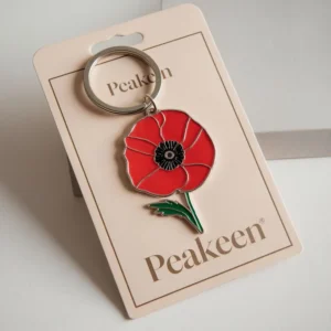 Enamel poppy keyring featuring a vibrant red poppy design, perfect for adding a touch of remembrance to your keys.