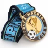 An enamel soccer medal inscribed with "Copa Madrid," symbolizing achievement in the sport.