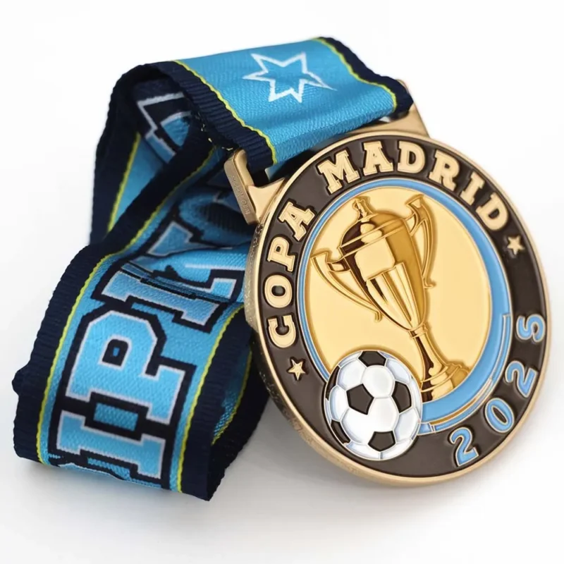 An enamel soccer medal inscribed with "Copa Madrid," symbolizing achievement in the sport.