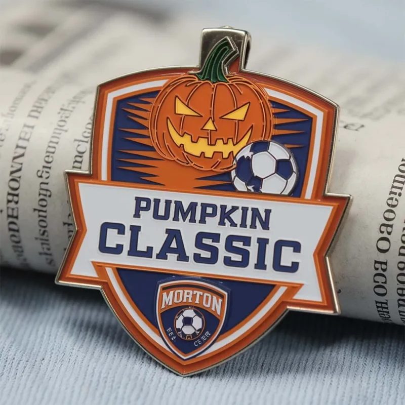 A medal featuring the words "Pumpkin Classic" in bold letters, designed for an enamel soccer medal event.