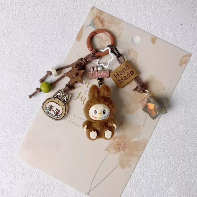 Brown bunny keychain featuring a small bear, designed as a Labubu keychain.
