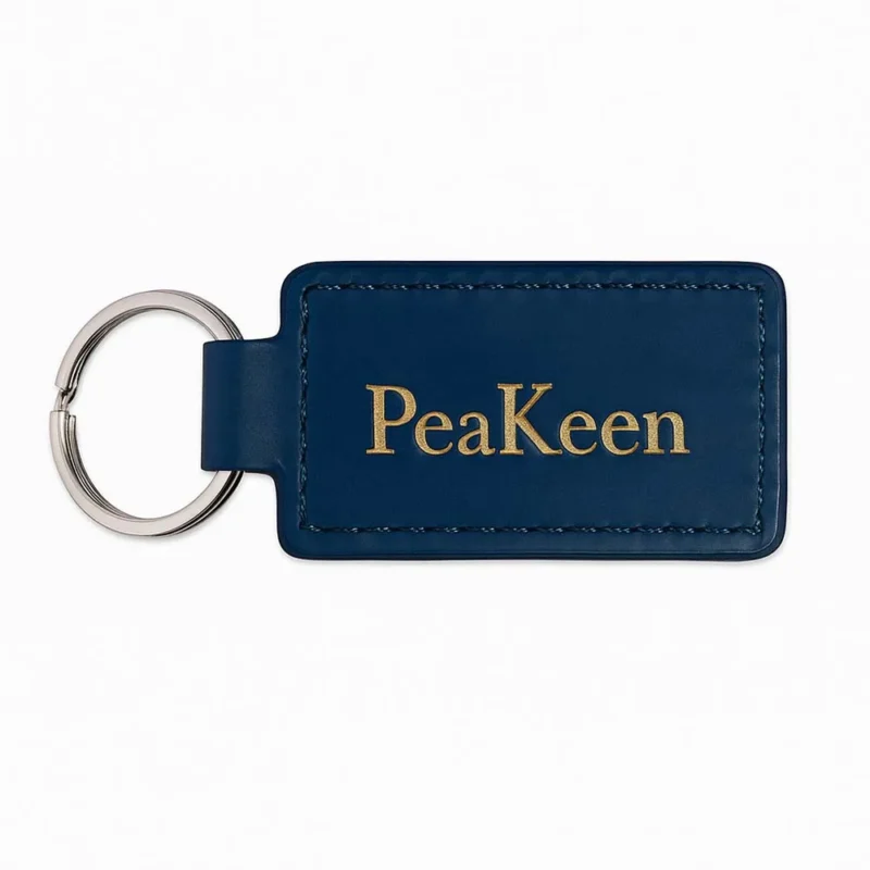 Personalized navy leather keychain with embossed design, perfect for keeping keys organized and stylish.