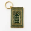 Keychain featuring the phrase "Work Hard Pray Harder" alongside a small prayer mat design.