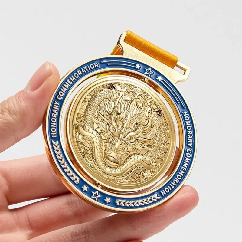 A person proudly holds a gold medal featuring a dragon, part of a spinning medal collection.
