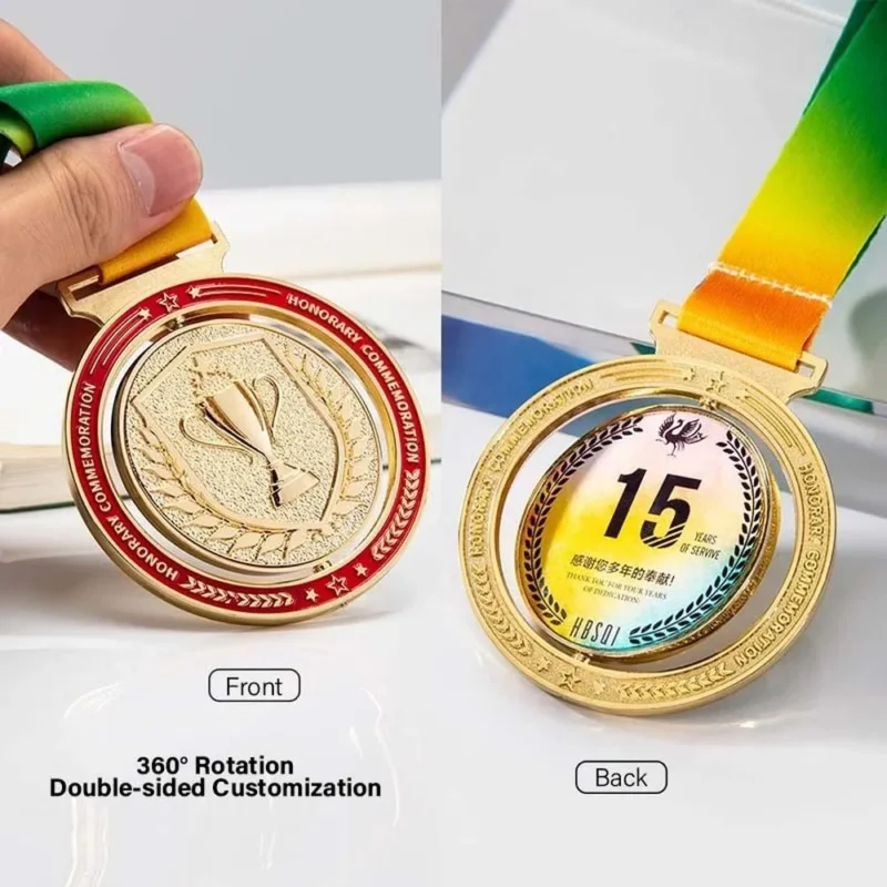 Two spinning gold medals labeled "double sided" reflecting light and showcasing their shiny surfaces.