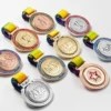 A collection of colorful spinning medals featuring various designs and shapes, showcasing their unique attributes.
