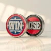 Two challenge coins labeled "win" and "lose," representing a flipping game or decision-making challenge.