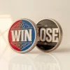 Two custom challenge coins displaying the words "win" and "lose" for a flipping game.