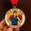 Detailed view of a boxing medal displaying text, highlighting a victory in a boxing competition.