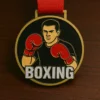 A medal featuring the word "boxing" prominently displayed on its surface.
