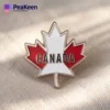 Custom maple leaf lapel pin representing Canada, featuring intricate detailing and vibrant colors.