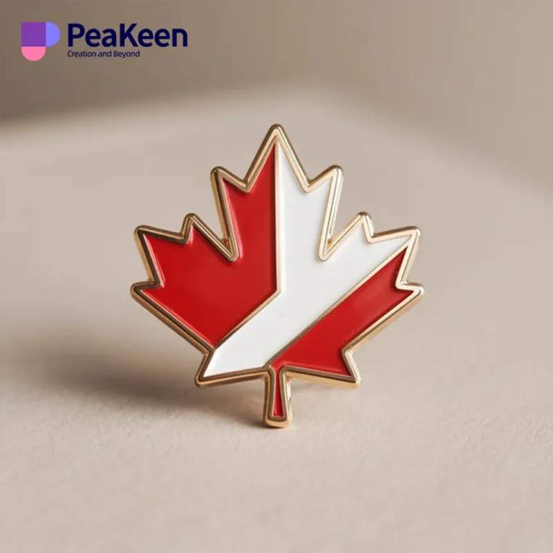 Red and white maple leaf pin representing Canada, featuring a classic design suitable for clothing or accessories.