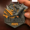Black and orange handball medal, showcasing a dynamic design, symbolizing achievement in the sport of handball.