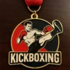 A medal featuring the word "kickboxing" prominently displayed on its surface.