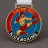 A kickboxing medal featuring the text "custom text" prominently displayed on its surface.