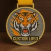 A medal featuring a detailed tiger head design, symbolizing achievement and strength.