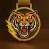 A medal featuring a detailed tiger head design, symbolizing strength and achievement.