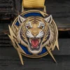 A tiger medal featuring a prominent lightning bolt design in the center.