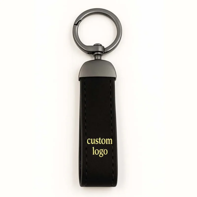 Black leather keychain featuring the words "custom logo," showcasing genuine leather craftsmanship.