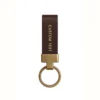 Genuine leather keychain featuring the words "custom text" prominently displayed.