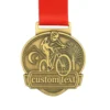 Gold medal featuring custom text, representing achievement in cycling competitions.