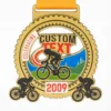 A cycling medal featuring the words "custom text 2009" engraved on its surface.