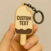 Custom text ice cream keychain featuring a colorful ice cream cone design.