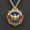 A gold medal featuring a blue and gold design, symbolizing achievement in soccer.