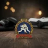 Medal featuring the words "spinning champion," awarded for excellence in grappling competitions.