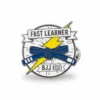 Yellow belt pin featuring the words "Fast Learner" in bold text.