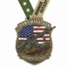 Army marathon medal featuring a rifle and American flag, symbolizing military achievement and patriotism.