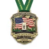 Marine Corps Marathon medal displaying the inscription "honor, duty & country."