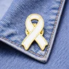 Solid white awareness ribbon enamel pin displayed on denim fabric, representing support for general causes, charity events, or social initiatives.