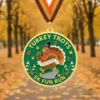 Medal featuring the text "Turkey Trots 5K Fun Run," symbolizing participation in a festive running event.
