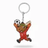 A cartoon moose mascot wearing a red soccer jersey with the number 1, celebrating with raised arms while holding a soccer ball, attached to a keychain.