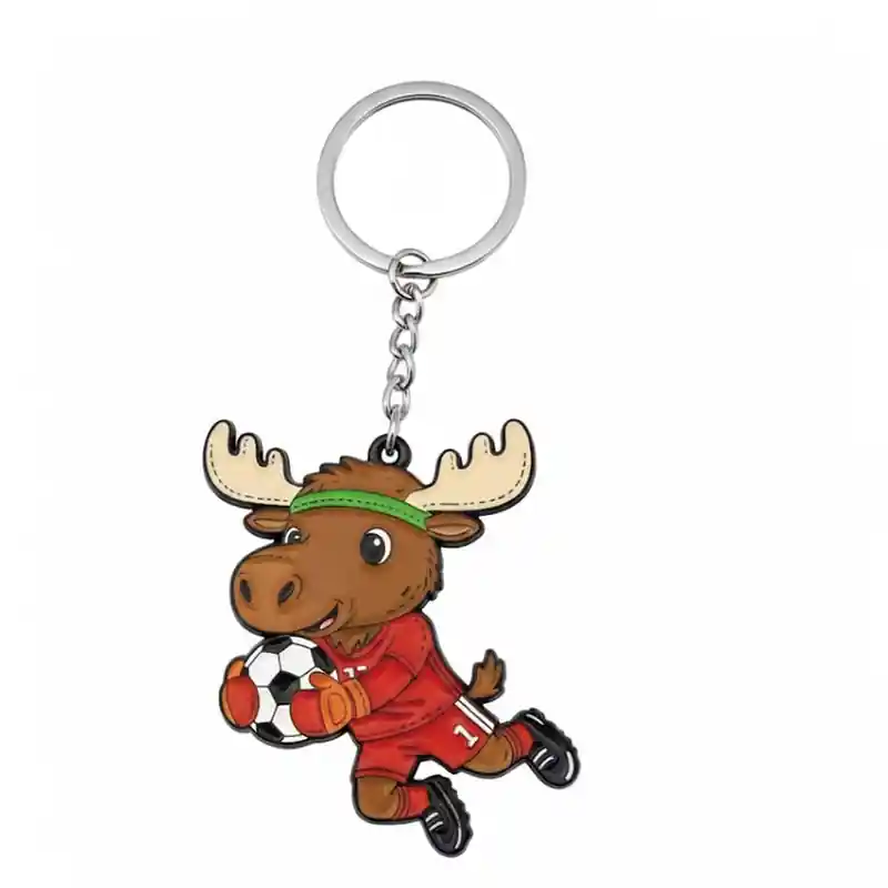 A cartoon moose mascot wearing a red soccer jersey with the number 11, holding a soccer ball, attached to a keychain.