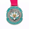 A silver medal featuring a lotus flower with a heart at the center, surrounded by a laurel wreath. The medal reads "RACE FOR LIFE 2026" at the top and "TOGETHER WE BEAT CANCER" at the bottom, symbolizing strength and unity in the fight against cancer.