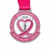 A silver medal with a pink heart and ribbon design, symbolizing unity against cancer. The medal includes the words "RACE FOR LIFE 2026" at the top and "UNITED AGAINST CANCER" at the bottom, with a silhouette of a runner in the center.