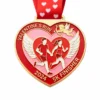 A heart-shaped red and pink medal featuring a couple of winged runners holding hands, Cupid flying above, and the inscription "VALENTINE'S RUN 2024 5K FINISHER" with a red ribbon adorned with heart patterns.