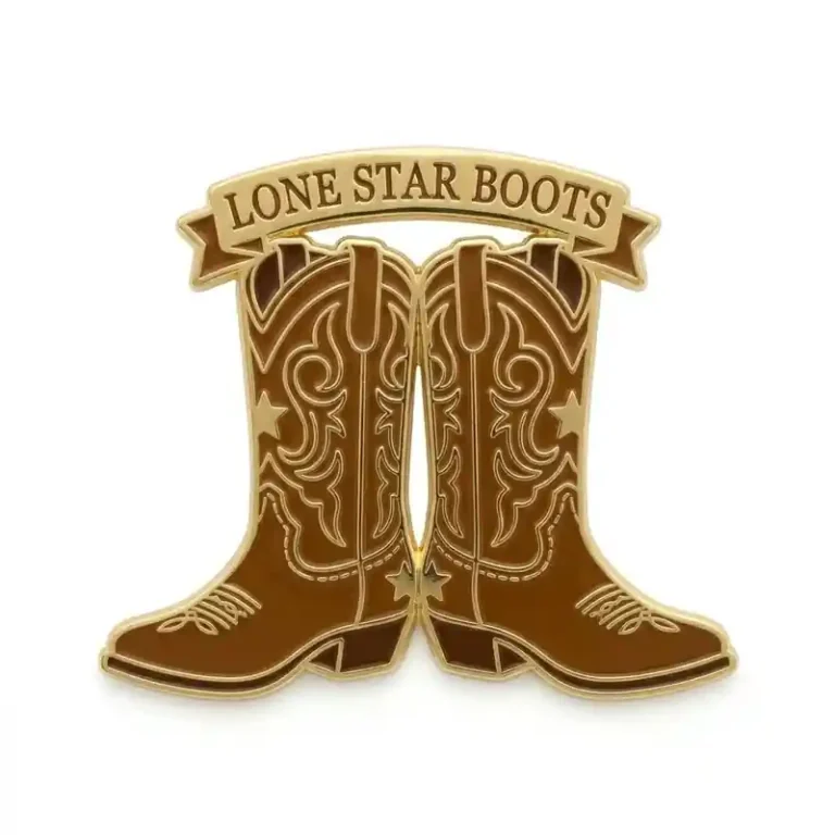 Western style enamel pin featuring a pair of detailed brown cowboy boots with a banner reading “Lone Star Boots.”